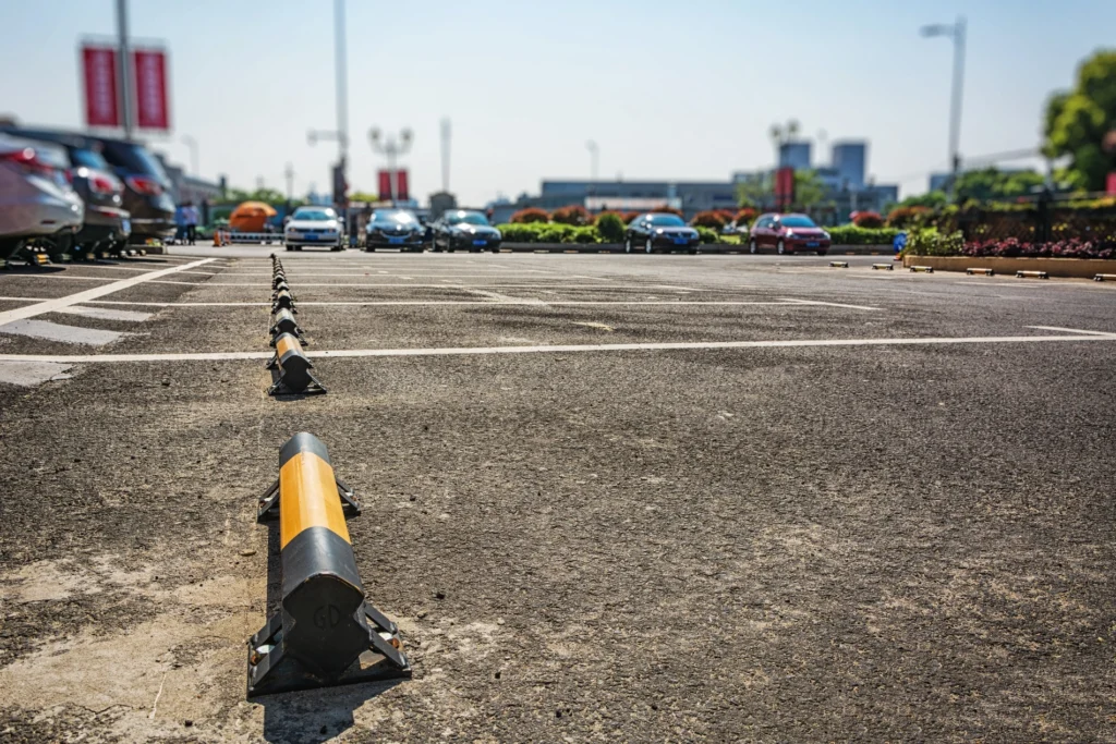 Concrete repair and parking lot repair with clear striping and parking lot maintenance for safe vehicle access