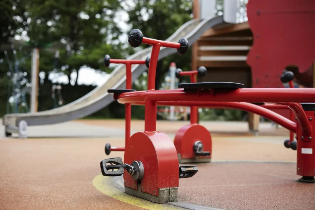 Playground with durable rubber paving surface providing safety for children