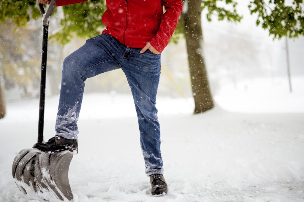 man with shovel in snow