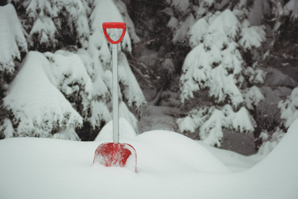 shovel deep in snow