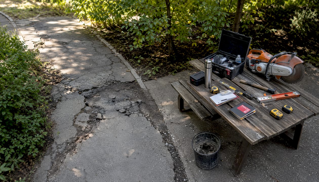Concrete walkway damage and maintenance tools in Edmonton