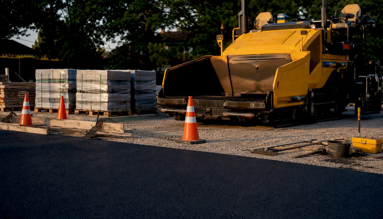 Asphalt paving machinery at construction site