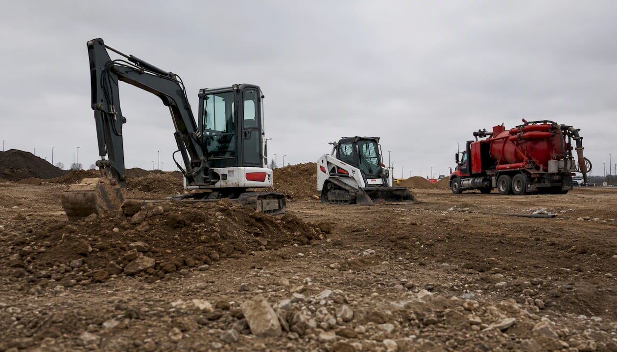 Variety of excavation equipment at construction site