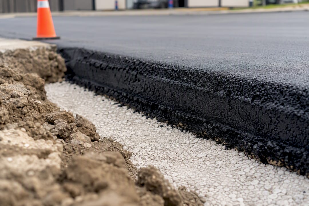 Cross-section of asphalt layers in commercial parking lot
