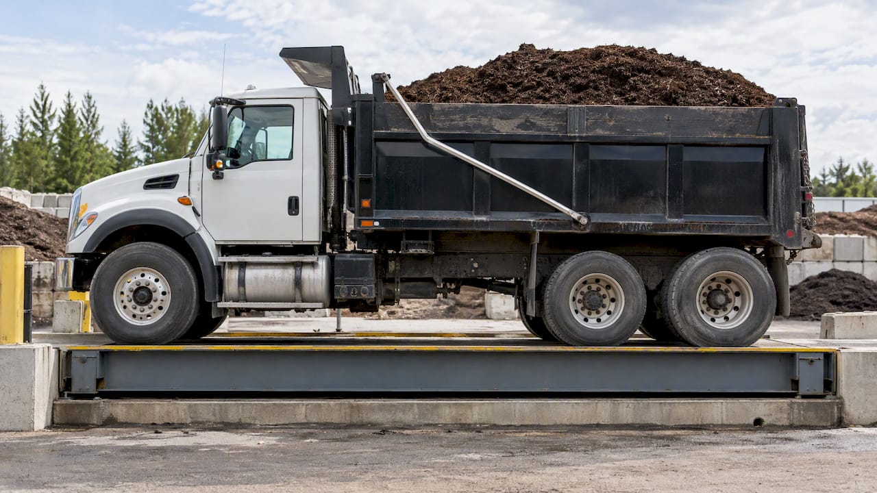 Mulch delivery truck on vehicle weighbridge